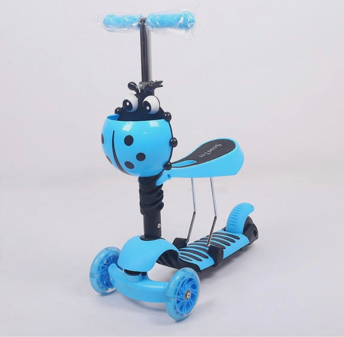 Children's scooter with blue handlebar and wheels on a light gray background
